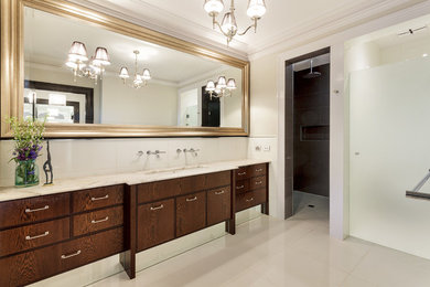 Large contemporary bathroom in Melbourne with dark wood cabinets, an open shower, white walls and ceramic floors.