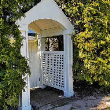 Classic White Garden Gate with Gabled Peaked Roof