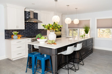 Large transitional porcelain tile and gray floor eat-in kitchen photo in New York with an undermount sink, shaker cabinets, medium tone wood cabinets, quartz countertops, blue backsplash, porcelain backsplash, stainless steel appliances, an island and multicolored countertops