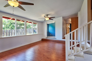 Inspiration for a mid-sized transitional painted straight staircase remodel in Hawaii with painted risers
