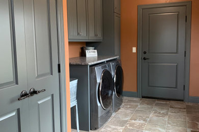 Laundry room - transitional laundry room idea in Other