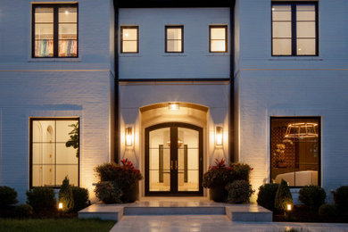 Inspiration for a huge transitional white two-story brick house exterior remodel in Other with a hip roof, a shingle roof and a gray roof