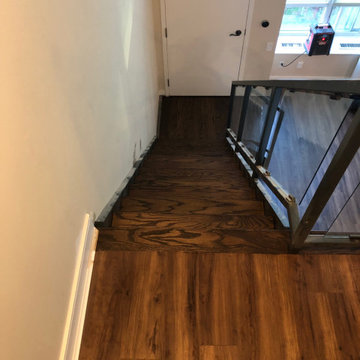 Luxury Vinyl, Baseboard and Custom Oak Staircase