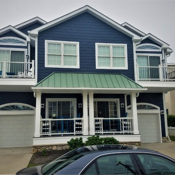Installing Evening Blue Hardie Siding with White Trim on Beach Home