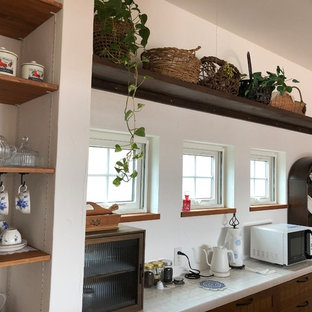 Farmhouse open concept kitchen pictures - Open concept kitchen - cottage galley dark wood floor and brown floor open concept kitchen idea in Other with medium tone wood cabinets and tile countertops
