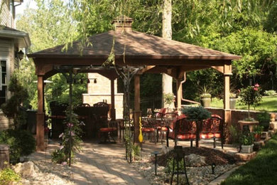 Pavilion covered patio with fireplace and outdoor bar.