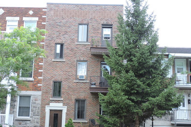 Example of an exterior home design in Montreal