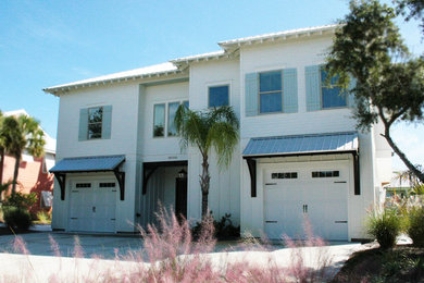 Inspiration for a coastal white two-story exterior home remodel