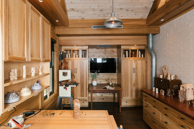 Example of a small country freestanding desk dark wood floor and brown floor home studio design in Atlanta with white walls