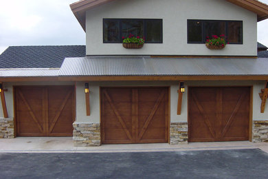 Photo of a mid-sized country attached three-car garage in Los Angeles.