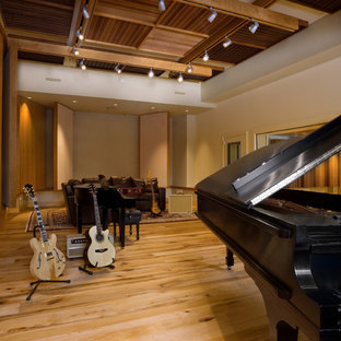 Large mountain style open concept light wood floor home theater photo in Burlington