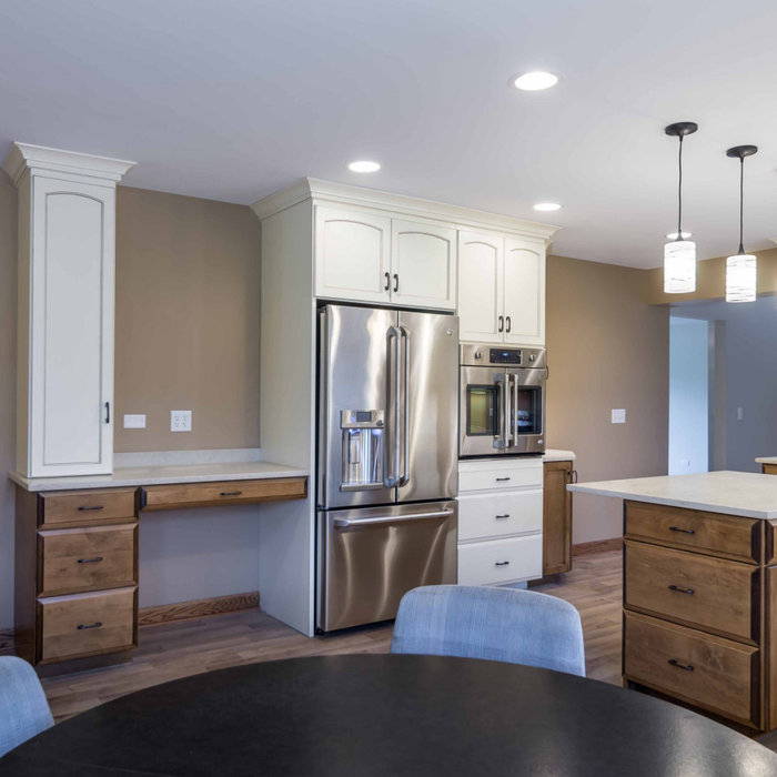 Inspiration for a mid-sized timeless l-shaped light wood floor, beige floor and wallpaper ceiling eat-in kitchen remodel in Chicago with a triple-bowl sink, recessed-panel cabinets, white cabinets, on