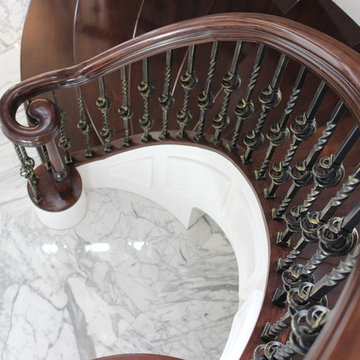 Walnut Circular Stair with Twist & Basket Iron Balusters