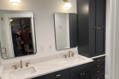 Example of a mid-sized arts and crafts master double-sink bathroom design in Seattle with shaker cabinets, black cabinets, an undermount sink, white countertops and a built-in vanity