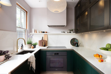 Eat-in kitchen - small modern u-shaped eat-in kitchen idea in DC Metro with green cabinets and no island