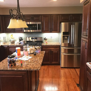 Kitchen remodel--maple capinets with granite and glass backsplash