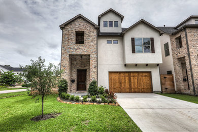 Large transitional white two-story mixed siding exterior home photo in Houston with a shingle roof