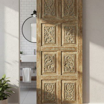 Antique Carved Barn Doors into a Spanish-Style Farmhouse