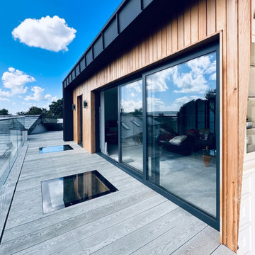 New balcony space outside private lounge with zinc finish and cedar cladding