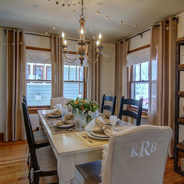 Garland, mismatched chairs, and a rustic table keep it casual and fun.