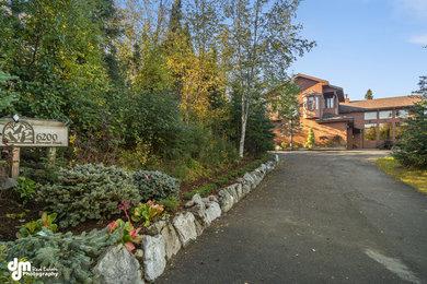 This is an example of a mid-sized traditional partial sun front yard landscaping in Other.