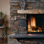 Stone fireplace with wood mantel