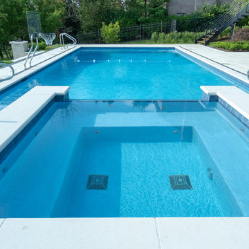 Burr Ridge Lap Pool with Raised Hot Tub and Waterfall