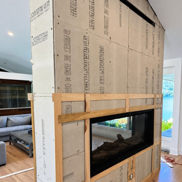CUSTOM FLOOR-TO-CEILING FIREPLACE WITH MITERED RETURNS