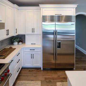 White Transitional Kitchen with Black Hardware and Glass Tile Backsplash
