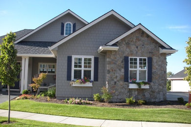 Inspiration for a gray one-story vinyl exterior home remodel in Portland