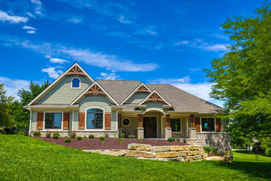 Inspiration for a mid-sized craftsman gray one-story mixed siding exterior home remodel in Other with a hip roof