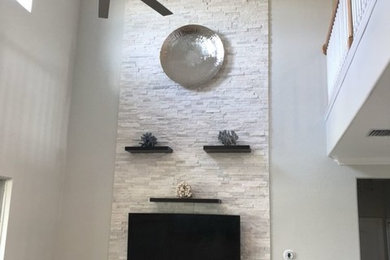 Example of a trendy living room design in Miami with white walls and a wall-mounted tv