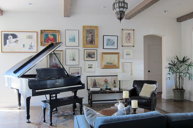 Example of a mid-sized eclectic open concept medium tone wood floor living room design in Los Angeles with white walls, a music area, no fireplace and no tv