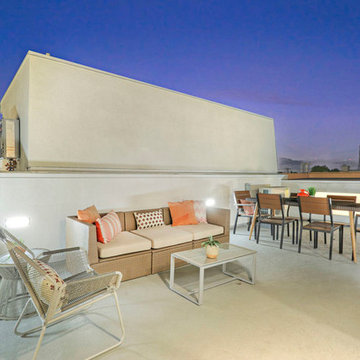 Brown and Orange Rooftop Deck Styling with Lounge and Dining Areas