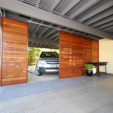 carport with timber backdrop