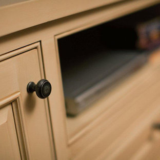 Inspiration for a timeless medium tone wood floor home theater remodel in Manchester with gray walls and a media wall