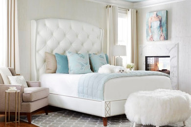 Bedroom - large transitional master medium tone wood floor bedroom idea in Atlanta with white walls, a two-sided fireplace and a stone fireplace