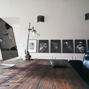 Inspiration for a modern study in Paris with grey walls, terracotta flooring, no fireplace, a freestanding desk and orange floors.