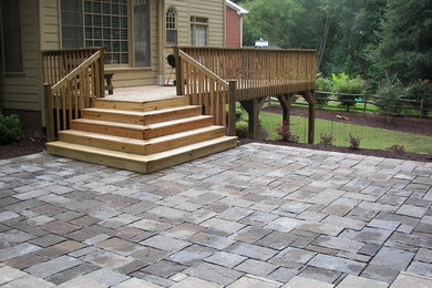 Design ideas for a mid-sized transitional backyard patio in Atlanta with concrete pavers and no cover.