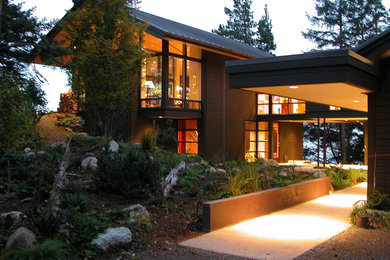 Mountain style wood exterior home photo in Seattle