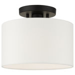Livex Lighting - Black Timeless, Transitional, Versatile, Semi Flush - The Meridian collection has a clean, crisp look and contemporary appeal. The hand-crafted off-white fabric hardback shade offers a diffused warm light. This small single-light drum shade adds character to this handsomely styled semi flush mount. Will adapt well in the hallway, bathroom, kitchen, small bedroom or by an entrance tastefully elevating your style. This sleek design is shown in a black finish.
