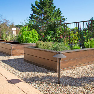 Inspiration for a large mediterranean side yard patio in San Luis Obispo with a vegetable garden and concrete slab.