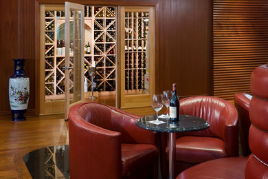 Inspiration for a mid-sized transitional medium tone wood floor wine cellar remodel in Philadelphia