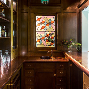 Bar with stained glass window of a historic Craftsman residence in Santa Monica,