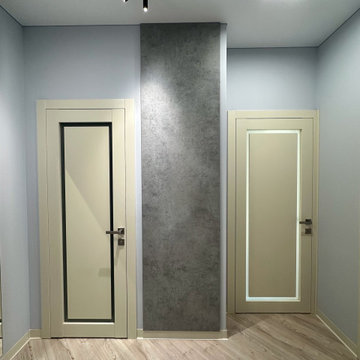 Compact Apartment Entryway with Built-In Storage and Illuminated Mirror
