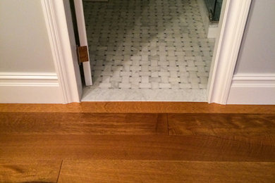 This is an example of a contemporary 3/4 bathroom in New York with light hardwood floors.