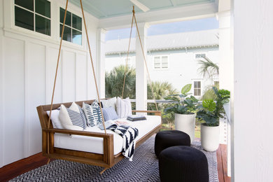 Example of a beach style home design design in Charleston
