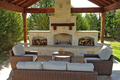 Mid-sized elegant backyard tile patio photo in Dallas with a fire pit and no cover