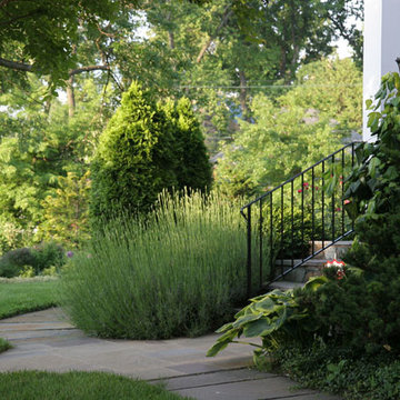 Entrance with Wrought Iron Handrail, Lamp Post, Ornamental Grass and Vines