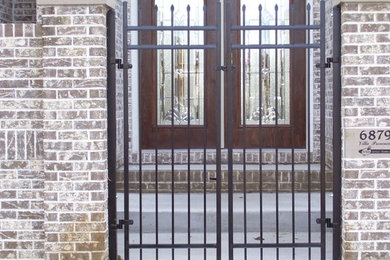 Small elegant entryway photo in Indianapolis with a medium wood front door